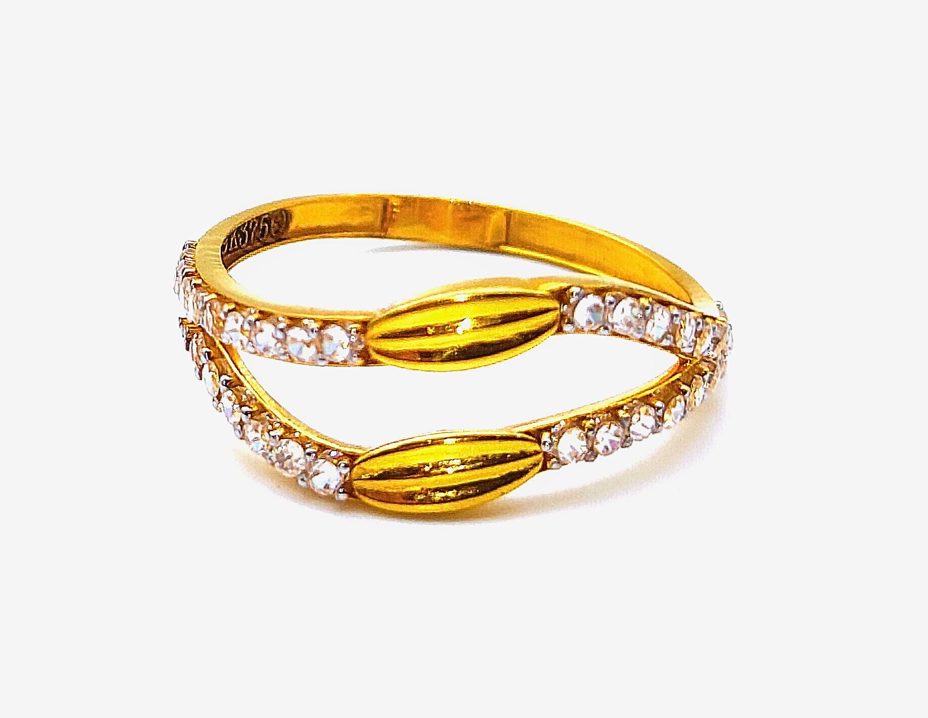 9k yellow gold bypass ring featuring cz stones and textured gold leaf accents with bis hallmark huid stamp