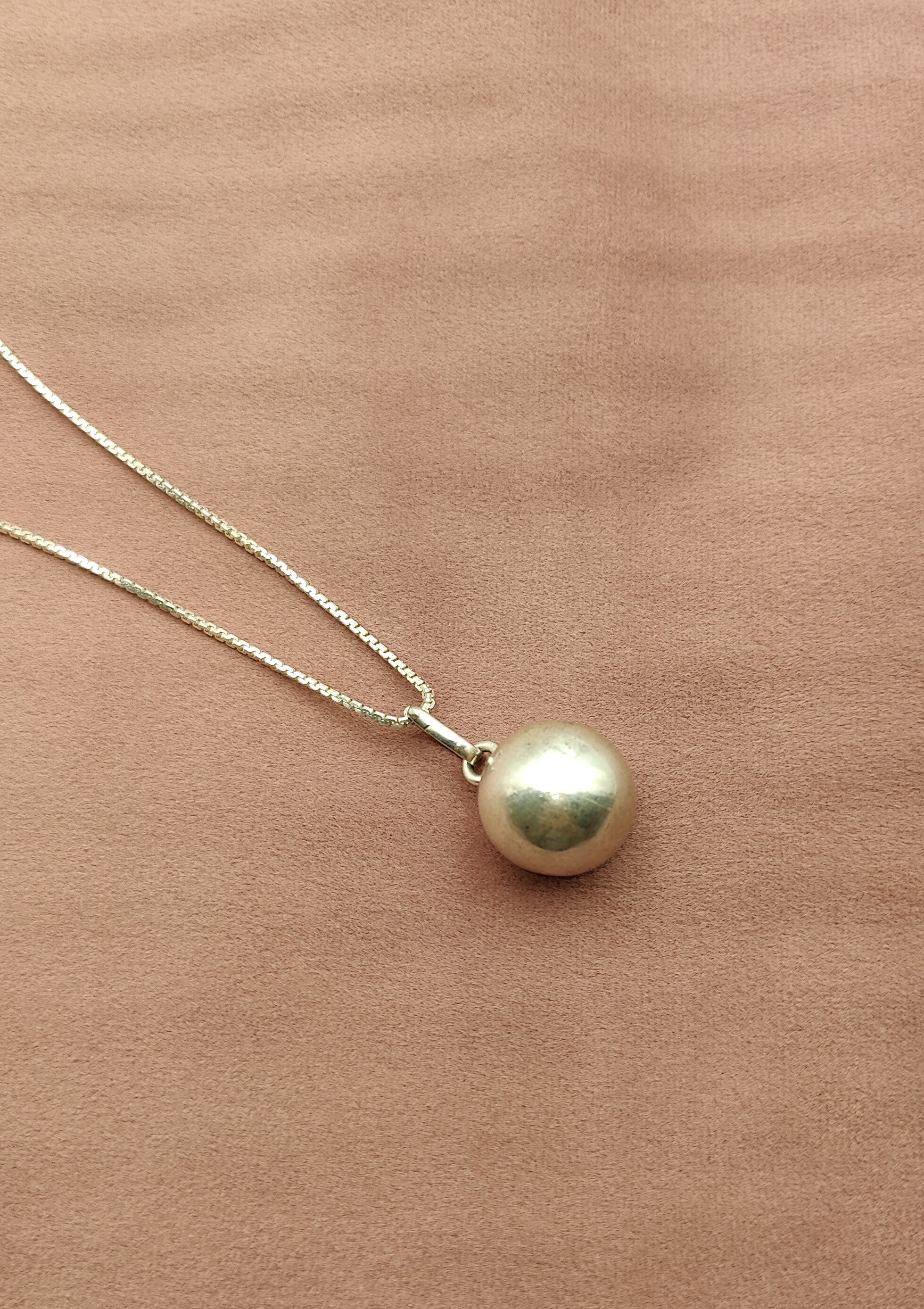 silver ball pendant with sound